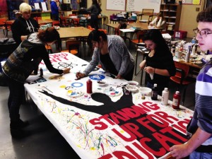 Art students working on banner